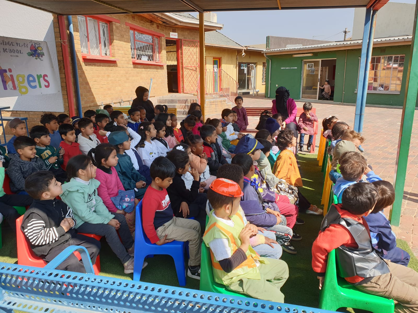 Children enjoying group time outdoors